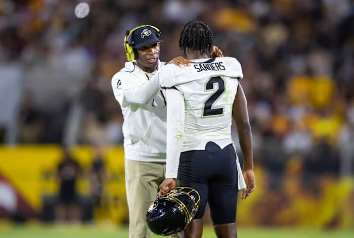 Colorado Buffaloes head coach Deion Sanders with son and quarterback Shedeur Sanders (2) against the Arizona State Sun Devils at Mountain America Stadium